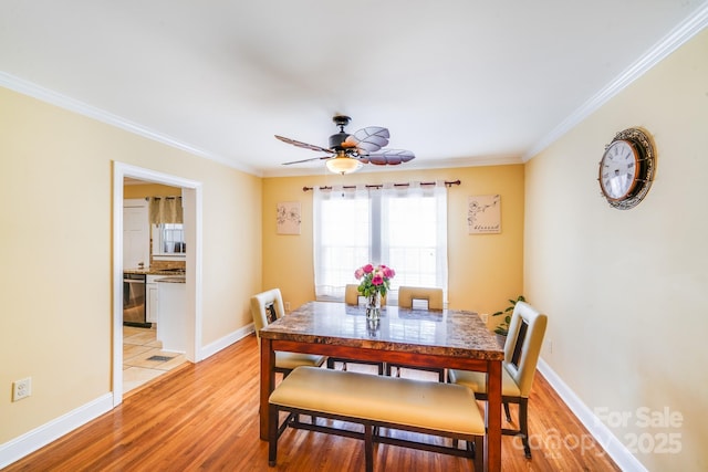 1004 Venus St, Kannapolis, NC 28083 - dining area with light wood-style flooring, ornamental molding, and a ceiling fan