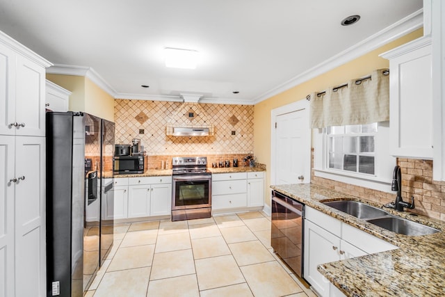 1004 Venus St, Kannapolis, NC 28083 - kitchen with stainless steel appliances, backsplash, crown molding, white cabinetry, and exhaust hood