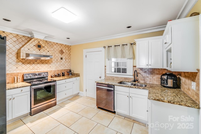 1004 Venus St, Kannapolis, NC 28083 - kitchen with stainless steel appliances, decorative backsplash, crown molding, light tile patterned floors, and white cabinets