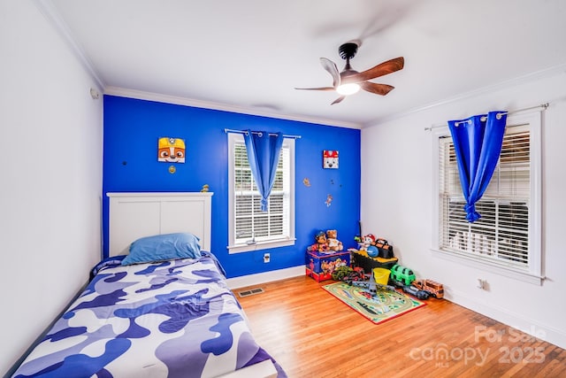 1004 Venus St, Kannapolis, NC 28083 - bedroom with ornamental molding, wood finished floors, and a ceiling fan