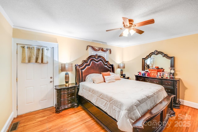 1004 Venus St, Kannapolis, NC 28083 - bedroom with light wood finished floors, crown molding, a textured ceiling, and ceiling fan