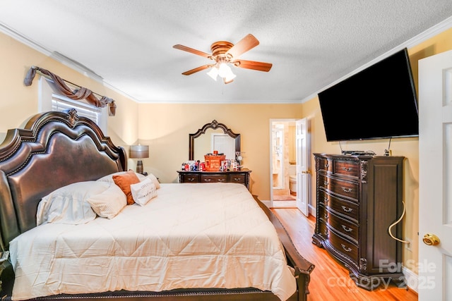 1004 Venus St, Kannapolis, NC 28083 - bedroom featuring light wood finished floors, ornamental molding, a textured ceiling, connected bathroom, and ceiling fan