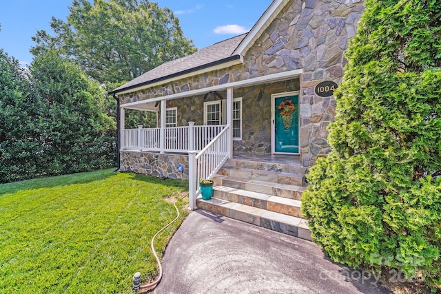 1004 Venus St, Kannapolis, NC 28083 - entrance to property featuring stone siding, a porch, and a lawn