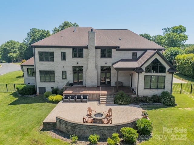 802 Capington Ln, Waxhaw, NC 28173 - back of house with french doors, a fire pit, a patio area, and brick siding