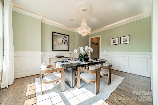 802 Capington Ln, Waxhaw, NC 28173 - dining space with a chandelier, ornamental molding, wainscoting, and wood finished floors