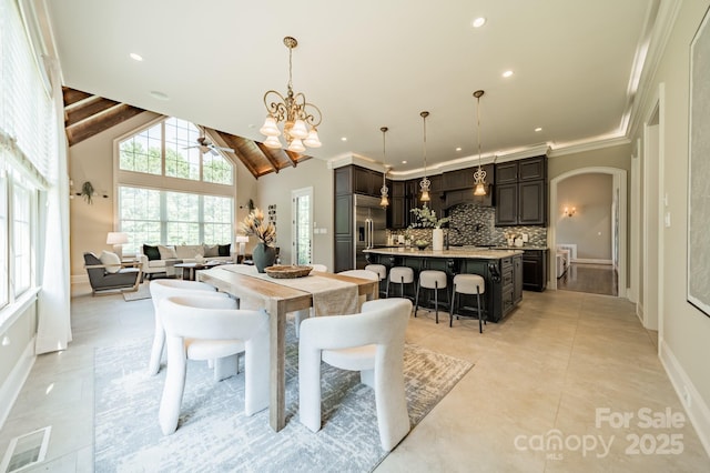 802 Capington Ln, Waxhaw, NC 28173 - dining area with arched walkways, light tile patterned floors, recessed lighting, ceiling fan, and a chandelier