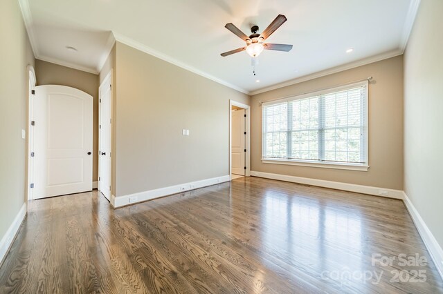 802 Capington Ln, Waxhaw, NC 28173 - spare room featuring a ceiling fan, wood finished floors, and crown molding