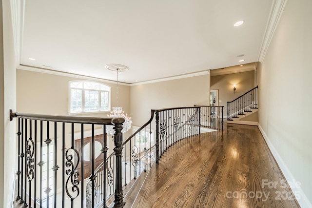 802 Capington Ln, Waxhaw, NC 28173 - corridor with a chandelier, ornamental molding, wood finished floors, an upstairs landing, and recessed lighting