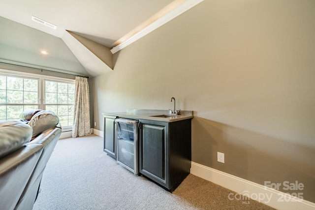 802 Capington Ln, Waxhaw, NC 28173 - indoor wet bar featuring light carpet, wine cooler, and crown molding