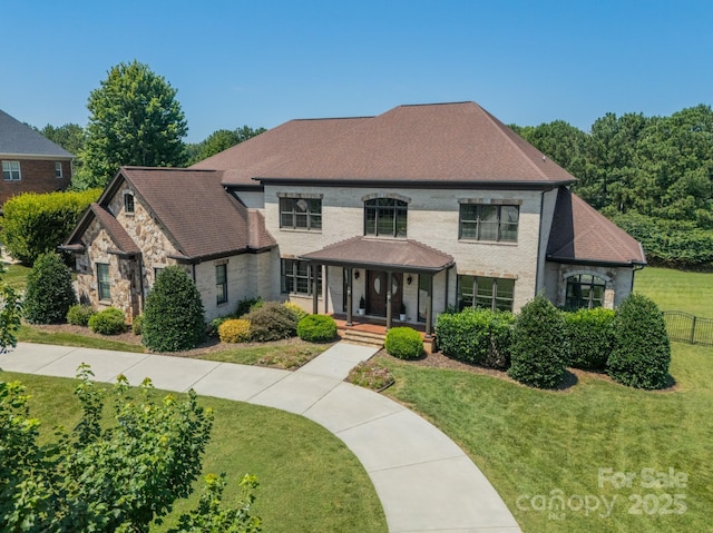 802 Capington Ln, Waxhaw, NC 28173 - view of front of house featuring covered porch, a front lawn, and stone siding