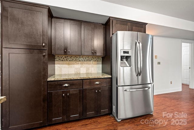 1230 Ridgebury Ter, Matthews, NC 28105 - kitchen featuring stainless steel refrigerator with ice dispenser, dark brown cabinetry, dark wood-style flooring, and backsplash
