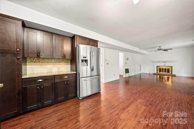 1230 Ridgebury Ter, Matthews, NC 28105 - kitchen with stainless steel refrigerator with ice dispenser, ceiling fan, dark brown cabinetry, and backsplash