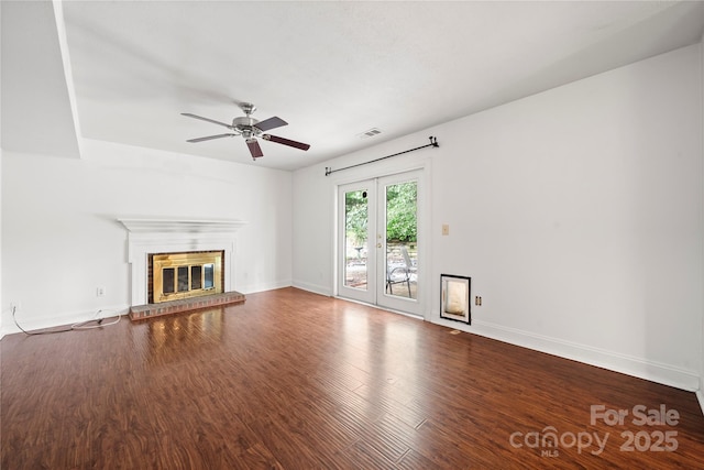 1230 Ridgebury Ter, Matthews, NC 28105 - unfurnished living room with ceiling fan, wood finished floors, and a brick fireplace