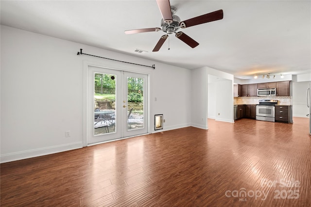 1230 Ridgebury Ter, Matthews, NC 28105 - unfurnished living room with ceiling fan and dark wood-style floors