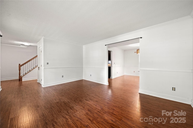 1230 Ridgebury Ter, Matthews, NC 28105 - unfurnished room featuring stairs, wood finished floors, ornamental molding, and a textured ceiling