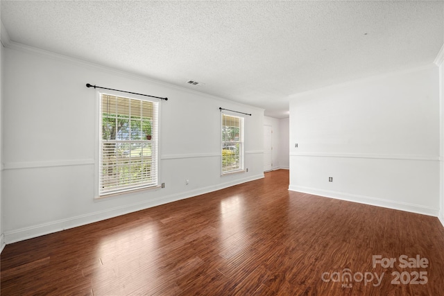 1230 Ridgebury Ter, Matthews, NC 28105 - spare room featuring a textured ceiling, wood finished floors, and ornamental molding