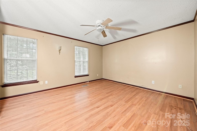 1230 Ridgebury Ter, Matthews, NC 28105 - unfurnished room with light wood-style flooring, a ceiling fan, crown molding, and a textured ceiling