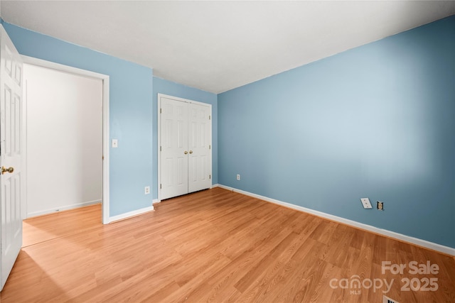 1230 Ridgebury Ter, Matthews, NC 28105 - unfurnished bedroom featuring light wood-style floors and a closet