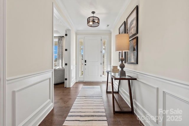 158 Nicholson Ln, Mooresville, NC 28115 - foyer featuring wainscoting, ornamental molding, a decorative wall, dark wood-style floors, and a chandelier