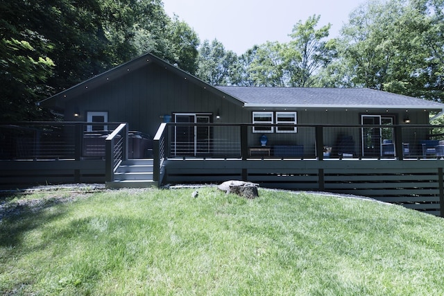 373 Fox Trace Dr, Sylva, NC 28779 - rear view of house featuring a deck, a shingled roof, and a yard