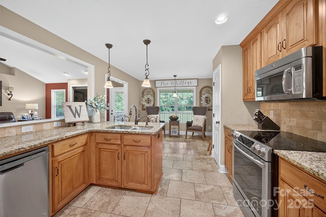 210 Cool Side Dr, Salisbury, NC 28146 - kitchen featuring appliances with stainless steel finishes, stone tile flooring, backsplash, light stone countertops, and decorative light fixtures
