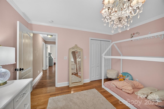 210 Cool Side Dr, Salisbury, NC 28146 - bedroom with ornamental molding, light wood-style flooring, a chandelier, and a closet