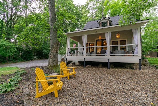 611 Hiawassee Rd, Black Mountain, NC 28711 - rear view of house featuring a shingled roof and a porch