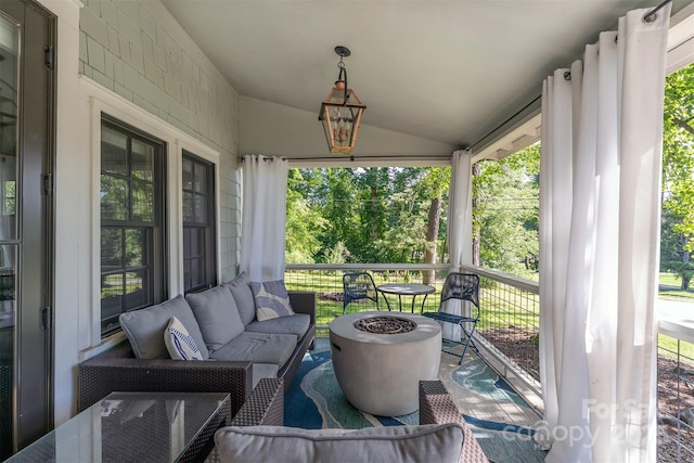 611 Hiawassee Rd, Black Mountain, NC 28711 - sunroom / solarium with vaulted ceiling, healthy amount of natural light, and an outdoor living space with a fire pit