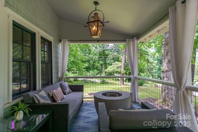 611 Hiawassee Rd, Black Mountain, NC 28711 - deck with an outdoor living space with a fire pit and view of wooded area