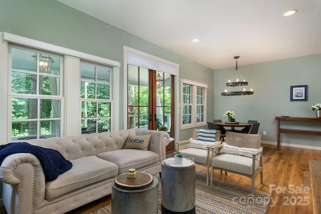 611 Hiawassee Rd, Black Mountain, NC 28711 - living room featuring a chandelier, wood-type flooring, plenty of natural light, recessed lighting, and french doors