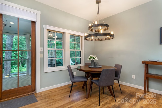 611 Hiawassee Rd, Black Mountain, NC 28711 - dining area with a chandelier and wood finished floors