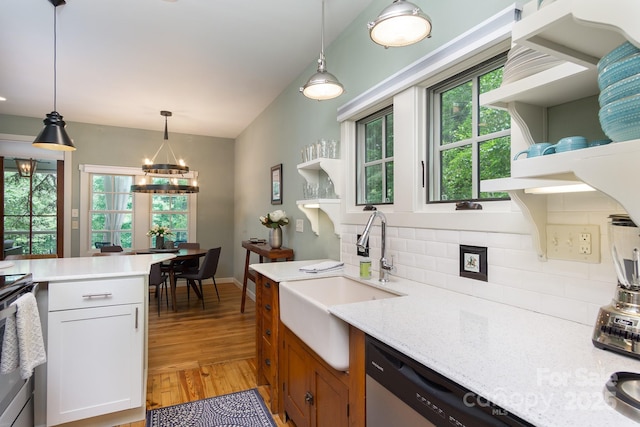 611 Hiawassee Rd, Black Mountain, NC 28711 - kitchen with open shelves, backsplash, light wood-type flooring, stainless steel appliances, and a chandelier