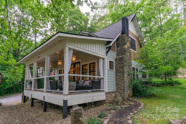 611 Hiawassee Rd, Black Mountain, NC 28711 - view of side of property featuring roof with shingles and board and batten siding