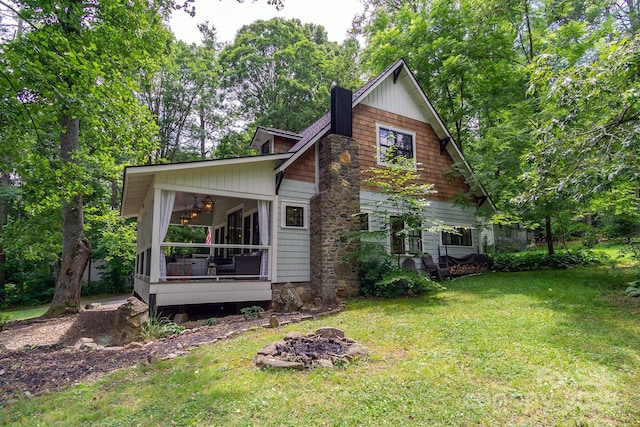 611 Hiawassee Rd, Black Mountain, NC 28711 - rear view of house with a sunroom and a yard