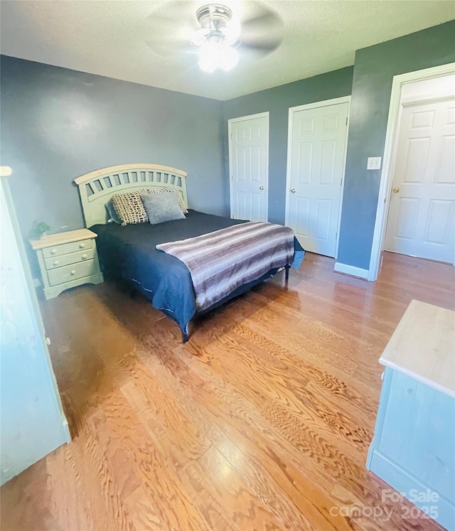 286 Little Wilkesboro Rd, Harmony, NC 28634 - bedroom with wood finished floors and a ceiling fan