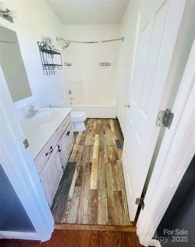 286 Little Wilkesboro Rd, Harmony, NC 28634 - full bathroom featuring wood finished floors, vanity, and bathtub / shower combination