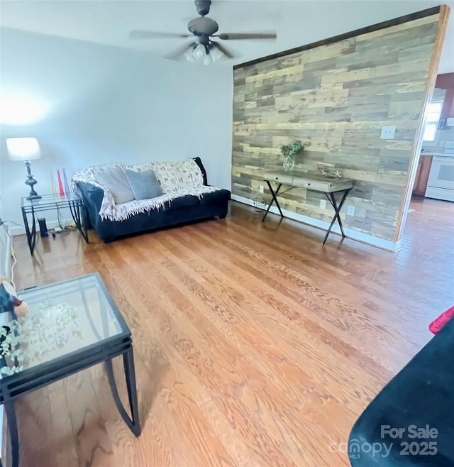 286 Little Wilkesboro Rd, Harmony, NC 28634 - living room featuring wood finished floors, ceiling fan, and wood walls