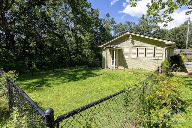 50 Taft St, Black Mountain, NC 28711 - view of side of property featuring brick siding and a fenced backyard