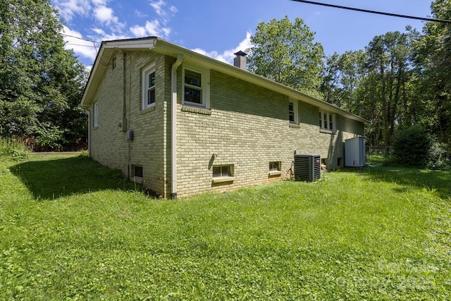 50 Taft St, Black Mountain, NC 28711 - view of side of property featuring a chimney, brick siding, and a lawn