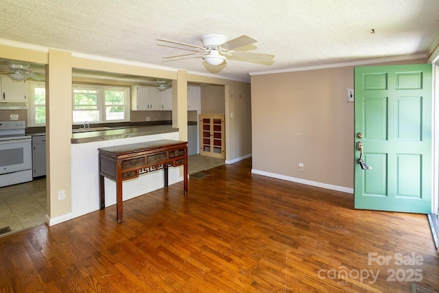 50 Taft St, Black Mountain, NC 28711 - living area with ceiling fan, a textured ceiling, ornamental molding, and wood finished floors