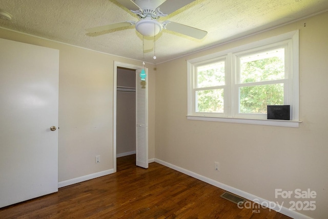 50 Taft St, Black Mountain, NC 28711 - unfurnished bedroom with wood finished floors, a closet, ceiling fan, and a textured ceiling