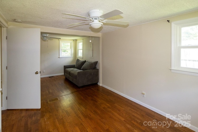 50 Taft St, Black Mountain, NC 28711 - living area featuring wood finished floors, a textured ceiling, and ceiling fan