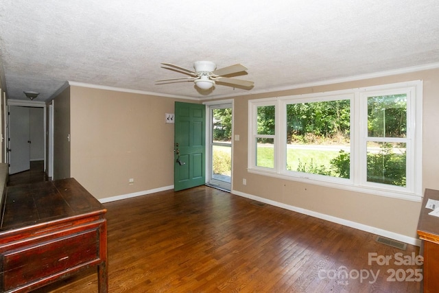 50 Taft St, Black Mountain, NC 28711 - empty room featuring dark wood-style floors, plenty of natural light, ceiling fan, a textured ceiling, and ornamental molding