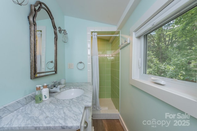 112 Byrd Rd, Black Mountain, NC 28711 - bathroom featuring vanity, tiled shower, and vaulted ceiling