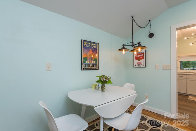 112 Byrd Rd, Black Mountain, NC 28711 - dining room with lofted ceiling and wood finished floors