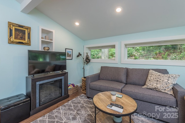 112 Byrd Rd, Black Mountain, NC 28711 - living area featuring vaulted ceiling, wood finished floors, recessed lighting, and a glass covered fireplace