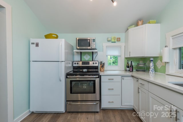 112 Byrd Rd, Black Mountain, NC 28711 - kitchen with stainless steel appliances, dark wood finished floors, white cabinetry, light countertops, and lofted ceiling