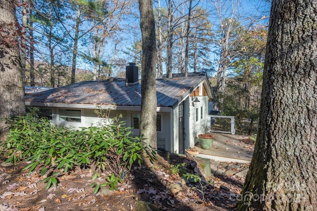 112 Byrd Rd, Black Mountain, NC 28711 - view of side of home with a chimney, a metal roof, and a deck
