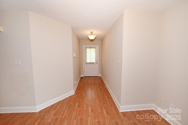 202 Pine Meadows St, Hickory, NC 28601 - hallway featuring light wood finished floors and a textured ceiling