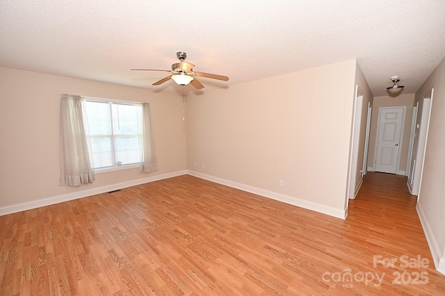 202 Pine Meadows St, Hickory, NC 28601 - unfurnished room featuring light wood-type flooring, a ceiling fan, and a textured ceiling